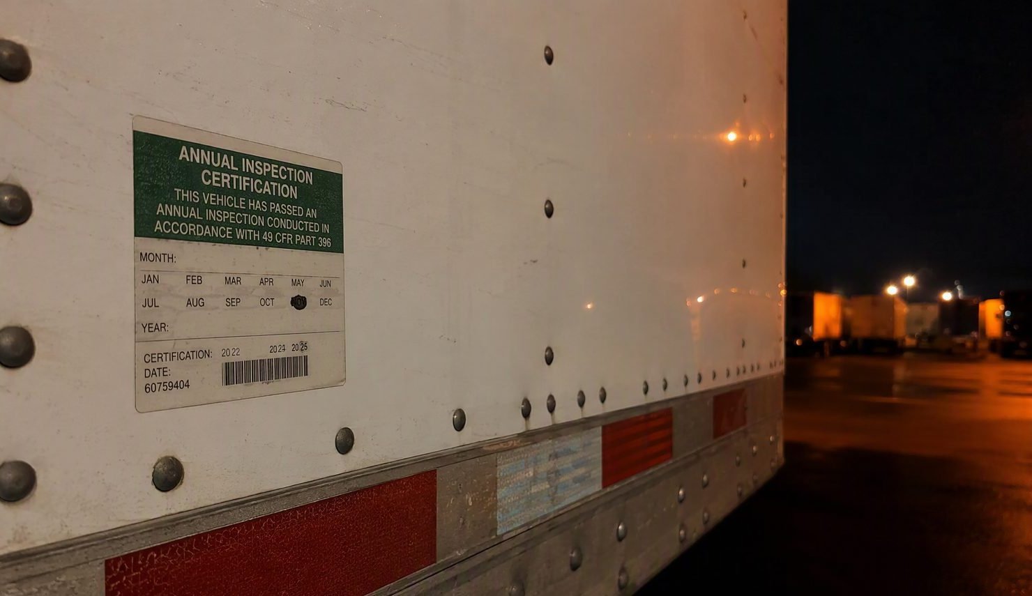 Annual DOT inspection sticker on a semi trailer side panel